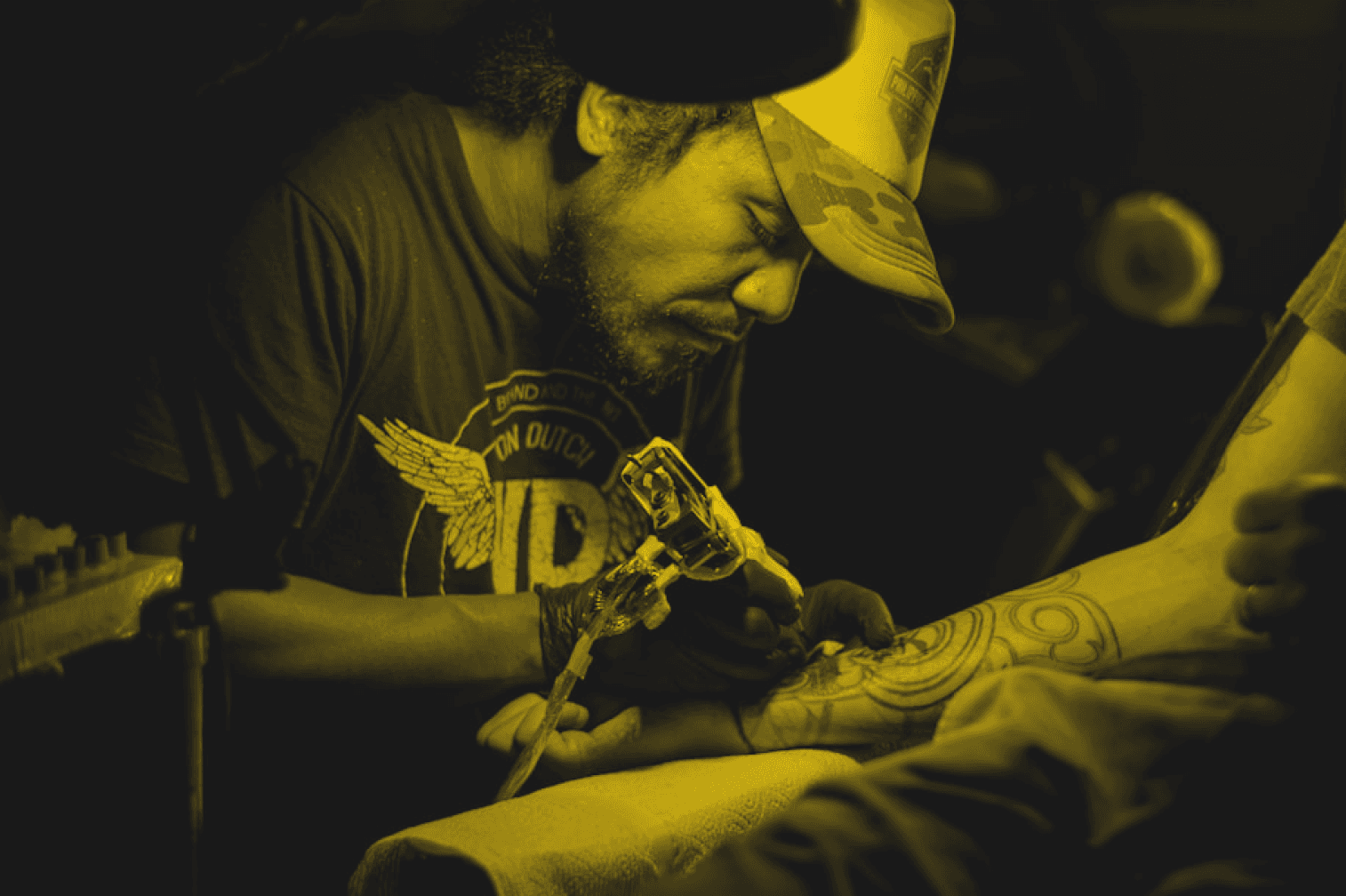 a tattoo artist making a tattoo